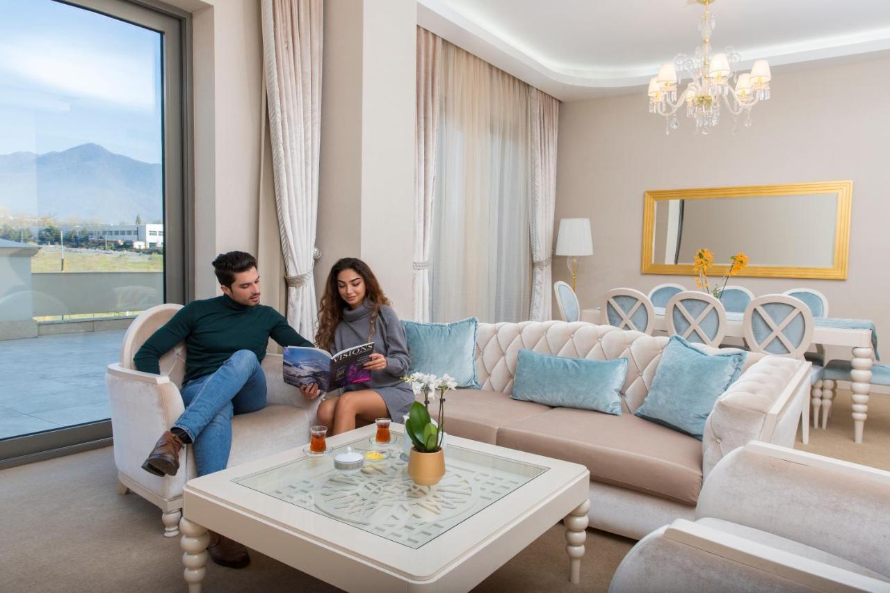 Gabala Garden Hotel Экстерьер фото A living room in a hotel suite